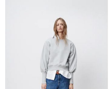 Sudadera manga abullonada de Zara