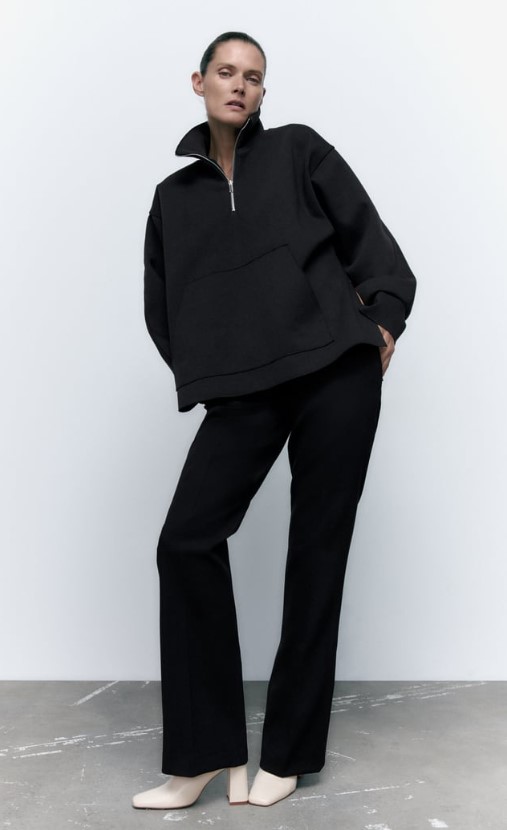 Sudadera con cremallera y aberturas