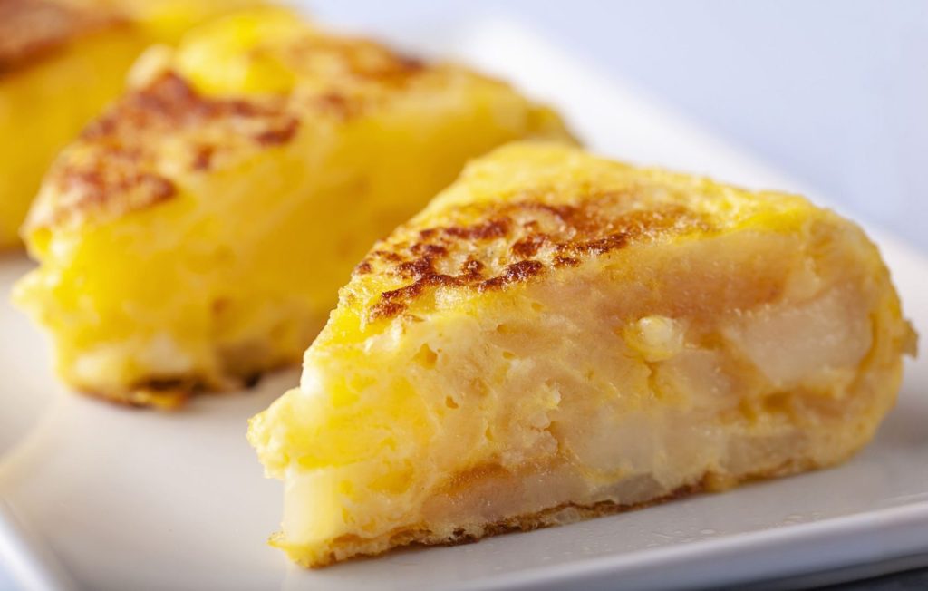 close up of a slice of spanish omelette royalty free image 1688114453 Moncloa
