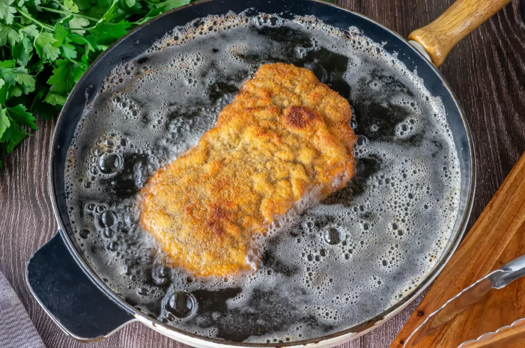 Ternera envuelta en auténtico Cachopo asturiano: ¡Una tradición que conquistará tu paladar! 1 Moncloa freir el cachopo Moncloa